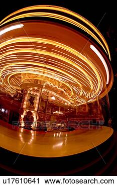 Stock Photography - lights on a spinning 
fairground carousel. 
fotosearch - search 
stock photos, 
pictures, images, 
and photo clipart