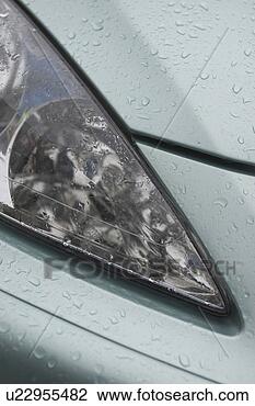 Stock Photo - car, vehicle, 
headlights, automobile, 
raindrops, drops. 
fotosearch - search 
stock photos, 
pictures, images, 
and photo clipart