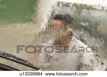 Stock Photo - one person, rainy 
day. fotosearch 
- search stock 
photos, pictures, 
images, and photo 
clipart