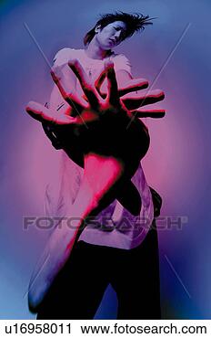 Stock Photography - young adult man 
posing, photography, 
cg, low angle 
view, toned image. 
fotosearch - search 
stock photos, 
pictures, images, 
and photo clipart