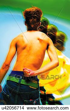 Stock Photo - young adult man 
posing, photography, 
cg, composite, 
rear view. fotosearch 
- search stock 
photos, pictures, 
images, and photo 
clipart