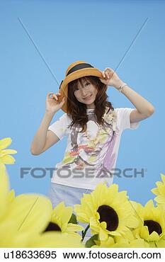 Stock Image - portrait of a 
teenage girl wearing 
a hat. fotosearch 
- search stock 
photos, pictures, 
images, and photo 
clipart
