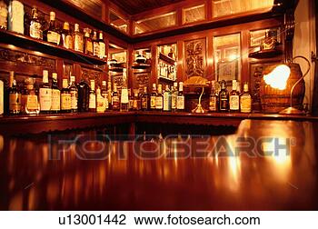 Stock Photo - row of liquor 
bottles at bar. 
fotosearch - search 
stock photos, 
pictures, images, 
and photo clipart