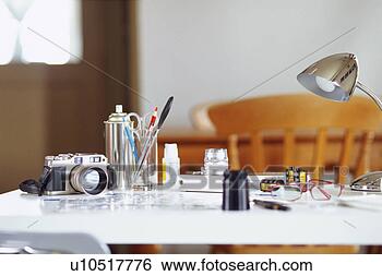 Stock Photo - camera and stationeries 
on table. fotosearch 
- search stock 
photos, pictures, 
images, and photo 
clipart