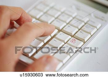 Stock Photo - close-up of keyboard 
with human hand. 
fotosearch - search 
stock photos, 
pictures, images, 
and photo clipart