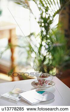 Stock Image - cup of tea and 
cds. fotosearch 
- search stock 
photos, pictures, 
images, and photo 
clipart