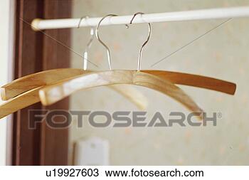 Stock Photo - hangers in closet. 
fotosearch - search 
stock photos, 
pictures, images, 
and photo clipart