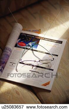 Picture - magazine and glasses. 
fotosearch - search 
stock photos, 
pictures, images, 
and photo clipart