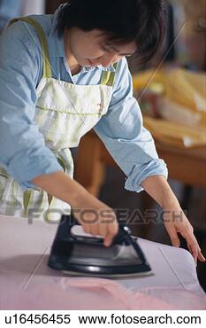 Stock Image - mid adult woman 
ironing. fotosearch 
- search stock 
photos, pictures, 
images, and photo 
clipart