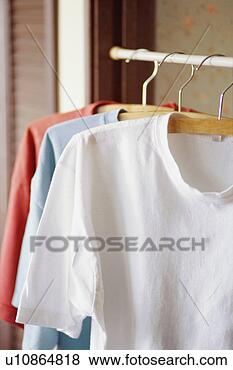 Stock Photo - t-shirts in closet. 
fotosearch - search 
stock photos, 
pictures, images, 
and photo clipart