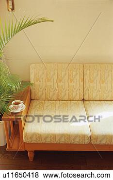 Stock Photo - tea cup on sofa. 
fotosearch - search 
stock photos, 
pictures, images, 
and photo clipart