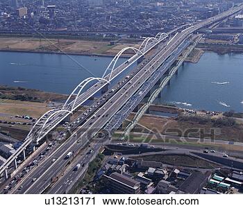 Stock Photography - aerial view of 
a spectacular 
architectural 
bridge over the 
river. fotosearch 
- search stock 
photos, pictures, 
images, and photo 
clipart