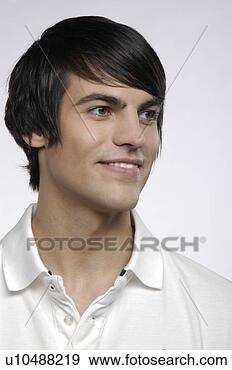 Stock Photograph - portrait of attractive 
young man wearing 
white polo-shirt, 
smiling. fotosearch 
- search stock 
photos, pictures, 
images, and photo 
clipart