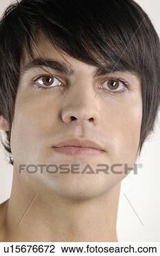 Stock Photo - portrait of young 
man with serious 
expression. fotosearch 
- search stock 
photos, pictures, 
images, and photo 
clipart
