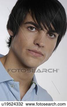 Stock Photo - portrait of young 
man with serious 
expression. fotosearch 
- search stock 
photos, pictures, 
images, and photo 
clipart
