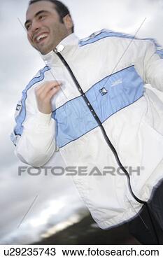 Stock Photo - young man jogging 
in spite of bad 
weather. fotosearch 
- search stock 
photos, pictures, 
images, and photo 
clipart