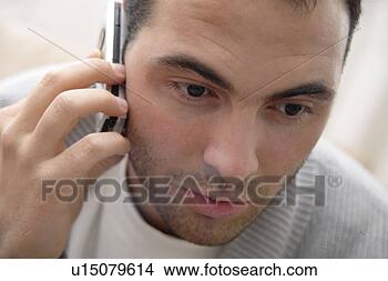 Stock Photo - young man using 
cell phone, portrait. 
fotosearch - search 
stock photos, 
pictures, images, 
and photo clipart