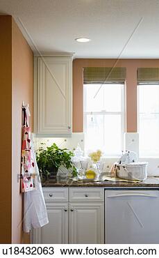 Stock Photo - aprons hanging 
on a kitchen wall. 
fotosearch - search 
stock photos, 
pictures, images, 
and photo clipart