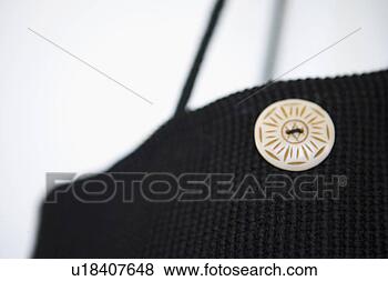 Stock Photo - black courderoy 
bag with white 
button. fotosearch 
- search stock 
photos, pictures, 
images, and photo 
clipart