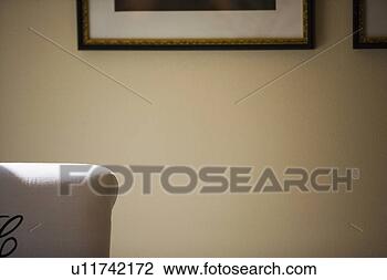 Stock Photo - deatil of monogramed 
chair and picture 
frame. fotosearch 
- search stock 
photos, pictures, 
images, and photo 
clipart