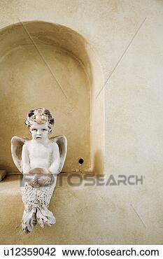 Stock Photo - detail of angel 
statue in arch. 
fotosearch - search 
stock photos, 
pictures, images, 
and photo clipart