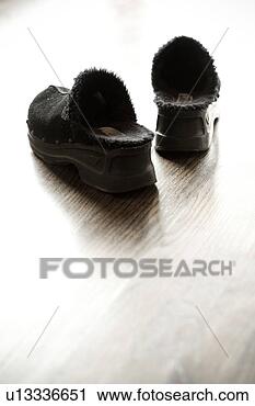 Stock Photography - detail of black 
slippers on hardwood 
floor. fotosearch 
- search stock 
photos, pictures, 
images, and photo 
clipart