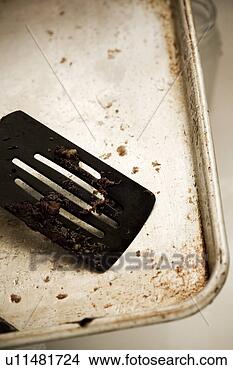 Stock Photo - detail of a dirty 
spatula on a dirty 
cookie sheet. 
fotosearch - search 
stock photos, 
pictures, images, 
and photo clipart