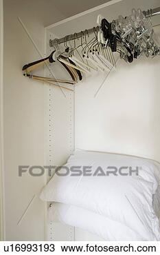 Stock Photo - detail of empty 
hangers on rod. 
fotosearch - search 
stock photos, 
pictures, images, 
and photo clipart