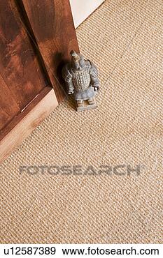 Stock Photograph - detail of small 
samurai staue 
propping a door 
open, close up. 
fotosearch - search 
stock photos, 
pictures, images, 
and photo clipart