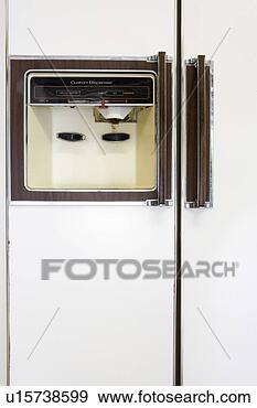 Stock Photograph - detail of water 
and ice dispencer 
on refrigerator. 
fotosearch - search 
stock photos, 
pictures, images, 
and photo clipart
