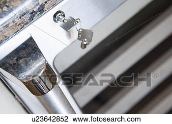 Stock Photo - detail of wine 
refrigerator lock. 
fotosearch - search 
stock photos, 
pictures, images, 
and photo clipart