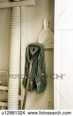 Stock Photo - janitorial mop 
and dustpan in 
white closet. 
fotosearch - search 
stock photos, 
pictures, images, 
and photo clipart