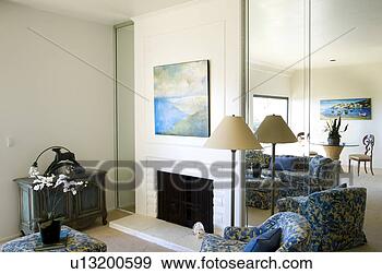 Stock Photograph - living room with 
fireplace and 
blue accents. 
fotosearch - search 
stock photos, 
pictures, images, 
and photo clipart