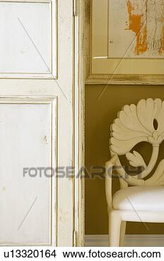 Stock Photo - ornate white chair 
and armoire. fotosearch 
- search stock 
photos, pictures, 
images, and photo 
clipart