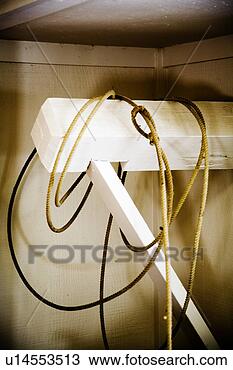 Stock Photo - rope/lasso hanging 
from white beam. 
fotosearch - search 
stock photos, 
pictures, images, 
and photo clipart