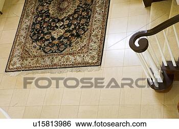 Stock Photo - rug and bannister 
in foyer. fotosearch 
- search stock 
photos, pictures, 
images, and photo 
clipart