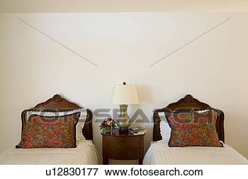 Picture - twin beds with 
ornate wood headboards. 
fotosearch - search 
stock photos, 
pictures, images, 
and photo clipart
