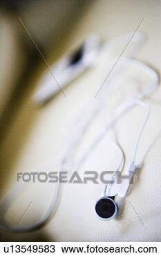Stock Photo - white mp3 player 
on white leather 
armchair. fotosearch 
- search stock 
photos, pictures, 
images, and photo 
clipart