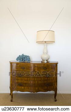 Picture - wood dresser and 
lamp. fotosearch 
- search stock 
photos, pictures, 
images, and photo 
clipart