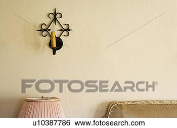 Stock Photo - wrought iron wall 
sconce with candle. 
fotosearch - search 
stock photos, 
pictures, images, 
and photo clipart