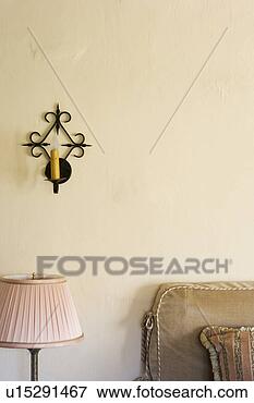 Picture - wrought iron wall 
sconce with candle. 
fotosearch - search 
stock photos, 
pictures, images, 
and photo clipart