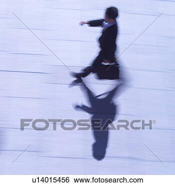 Stock Photo - a businessman 
walking on street, 
blurred motion. 
fotosearch - search 
stock photos, 
pictures, images, 
and photo clipart