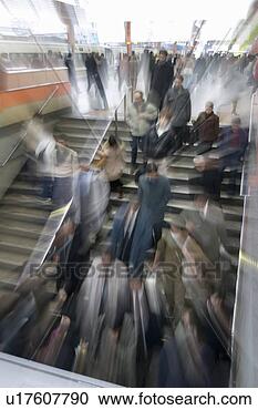 Stock Photography - group of people 
descending steps 
in station. fotosearch 
- search stock 
photos, pictures, 
images, and photo 
clipart