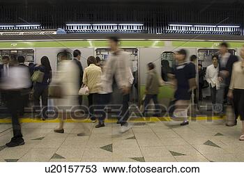 Stock Photo - people walking 
in a station. 
fotosearch - search 
stock photos, 
pictures, images, 
and photo clipart