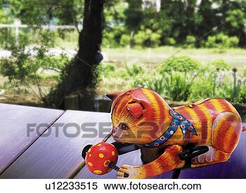Stock Illustration - toy doll, cat 
playing at engawa, 
side view, differential 
focus. fotosearch 
- search clipart, 
illustration, 
drawings and vector 
eps graphics images