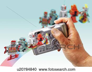 Stock Illustration - toy doll,  robots 
and digital camera, 
 high angle view, 
 differential. 
fotosearch - search 
clipart, illustration, 
drawings and vector 
eps graphics images