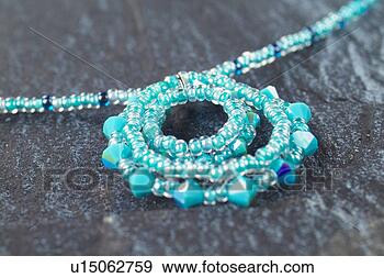 Stock Photograph - objects of craftwork, 
 accessory,  craftwork, 
 fine arts,  necklace. 
fotosearch - search 
stock photos, 
pictures, images, 
and photo clipart
