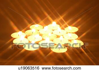 Stock Photo - burning candle, 
 light,  candlelight, 
 candle,  lighting, 
 candle. fotosearch 
- search stock 
photos, pictures, 
images, and photo 
clipart
