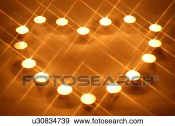 Stock Photograph - candlelight,  
light,  heart, 
 candle,  lighting, 
 burning candle. 
fotosearch - search 
stock photos, 
pictures, images, 
and photo clipart