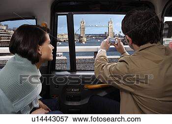 Picture - couple in taxi, 
view of tower 
bridge. fotosearch 
- search stock 
photos, pictures, 
wall murals, images, 
and photo clipart
